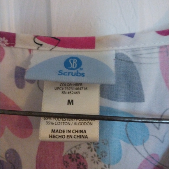 2/$16 Tops Scrubstar multi colored heart top - Picture 2 of 2